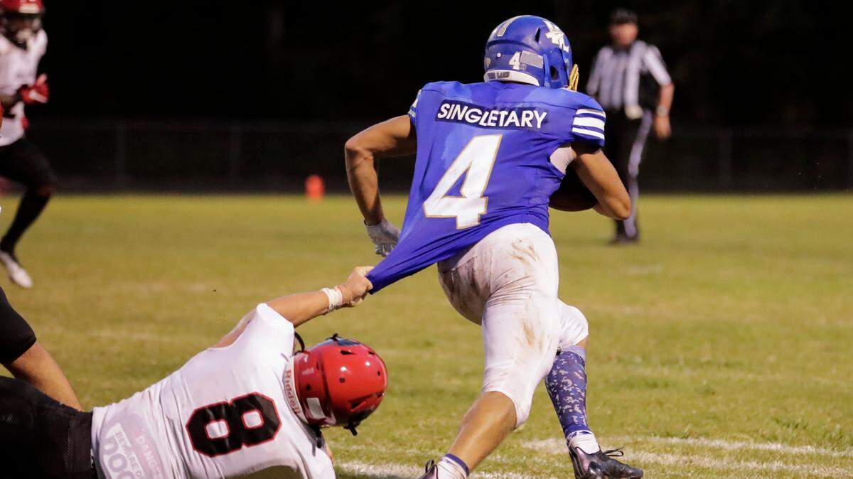 Indian Land’s (4) Jaden Singletary breaks free for extra yards in second half play as Indian Land hosts Nation Ford in Friday night football action. 8-20-2021.