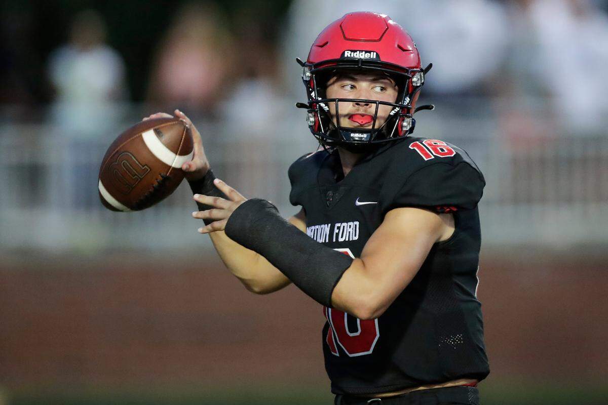 Nation Ford quarterback (16) Carson Black looks down field in first half action as Nation Ford hosts Catawba Ridge in a Friday night cross town football rivalry, 8-27-2021.