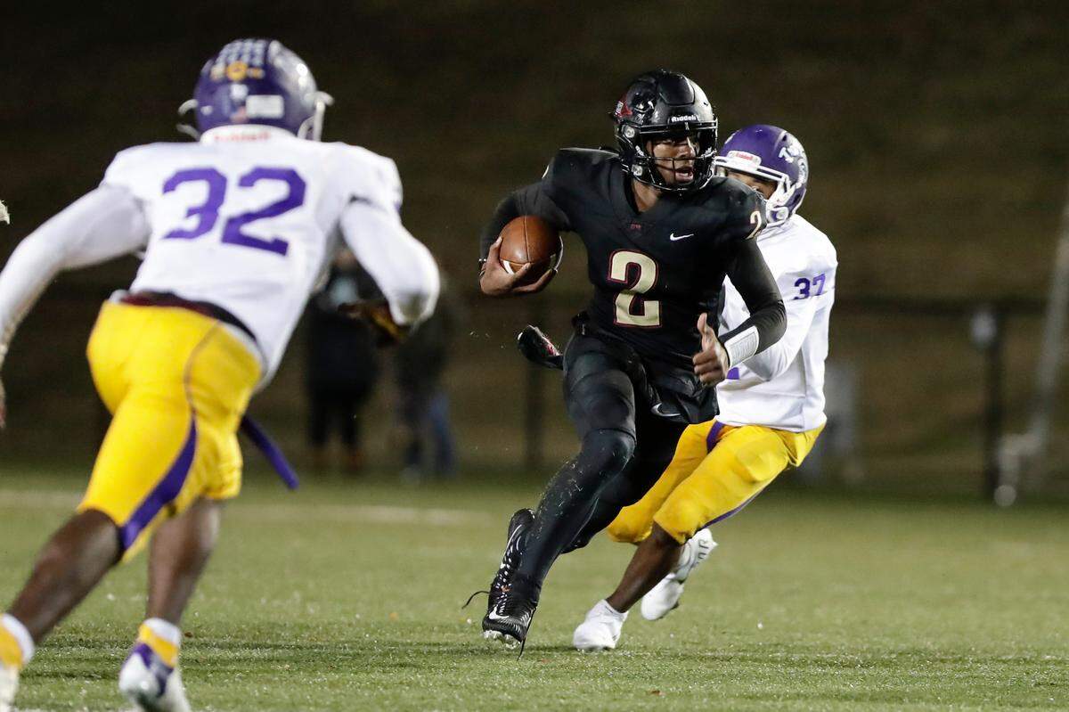 Rock Hill quarterback (2) Matthew Wilson keeps the ball for a Bearcat gain as Northwestern takes on Rock Hill in Friday night varsity football action, 10-29-2021.