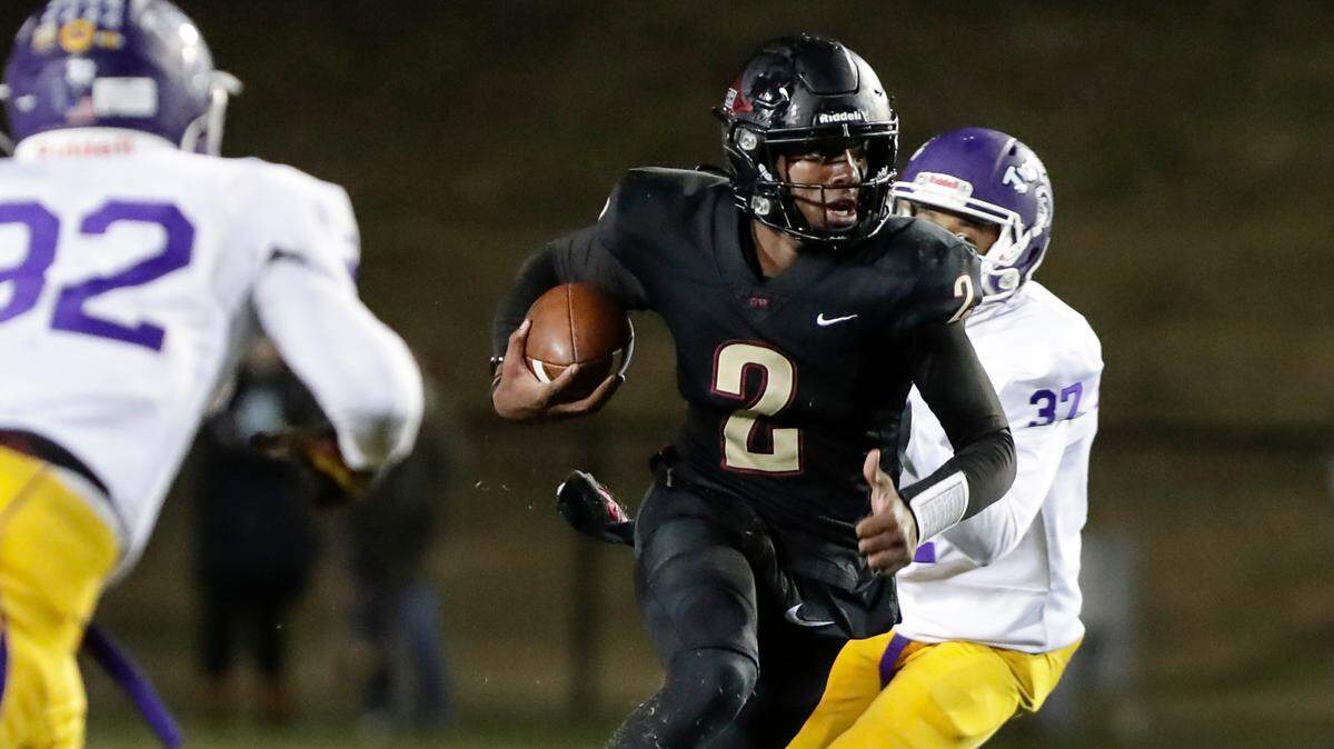 Rock Hill quarterback (2) Matthew Wilson keeps the ball for a Bearcat gain as Northwestern takes on Rock Hill in Friday night varsity football action, 10-29-2021.