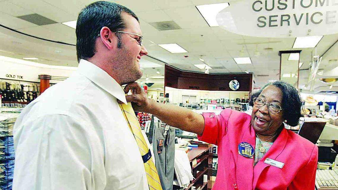 Pearl McCloud helps Stewart Huneycutt of Rock Hill pick out a new shirt and tie at the Belk store in 2007 at the Rock Hill Galleria. “I try and give every person the attention they deserve,” said McCloud, who had worked for the Rock Hill department store for 22 years.