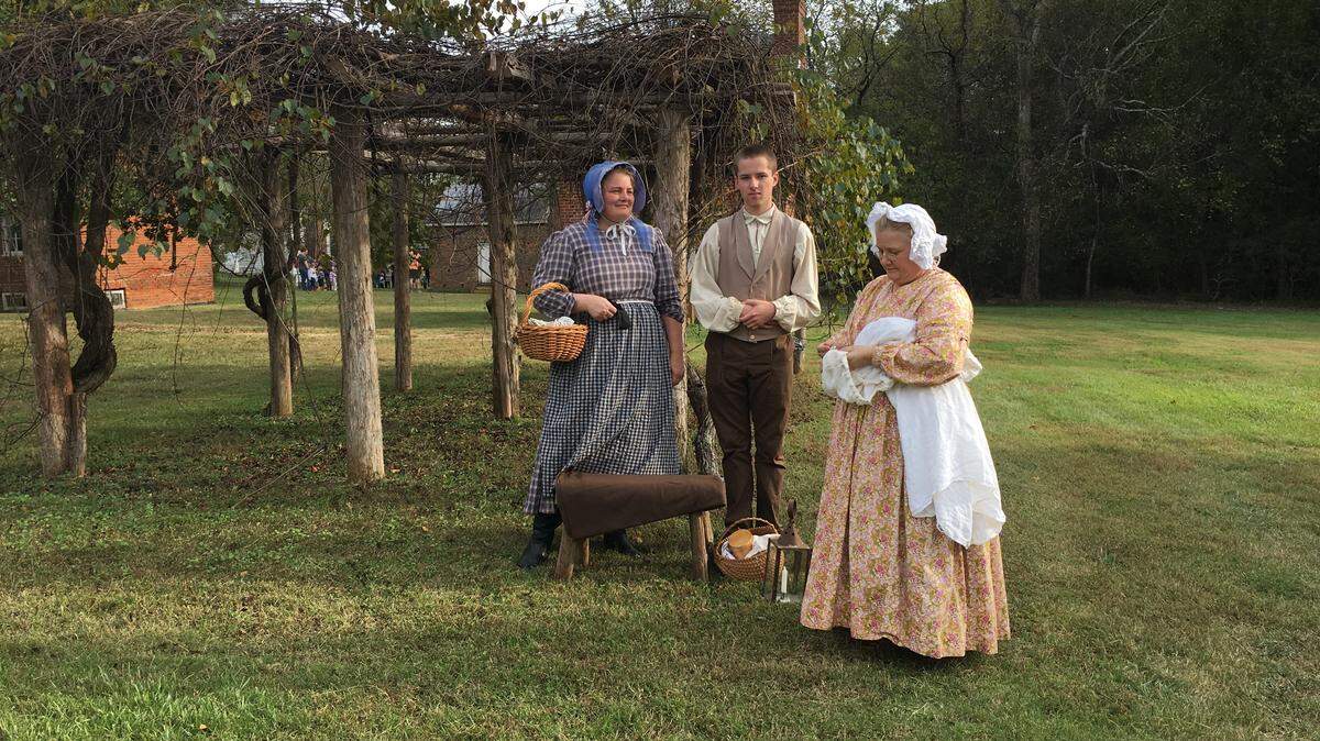 Period-dressed interpreters tell stories of the people who once lived in the Brattonsville community at “Spirits & Stories: Brattonsville by Twilight” Oct. 20 at the historic site in McConnells.