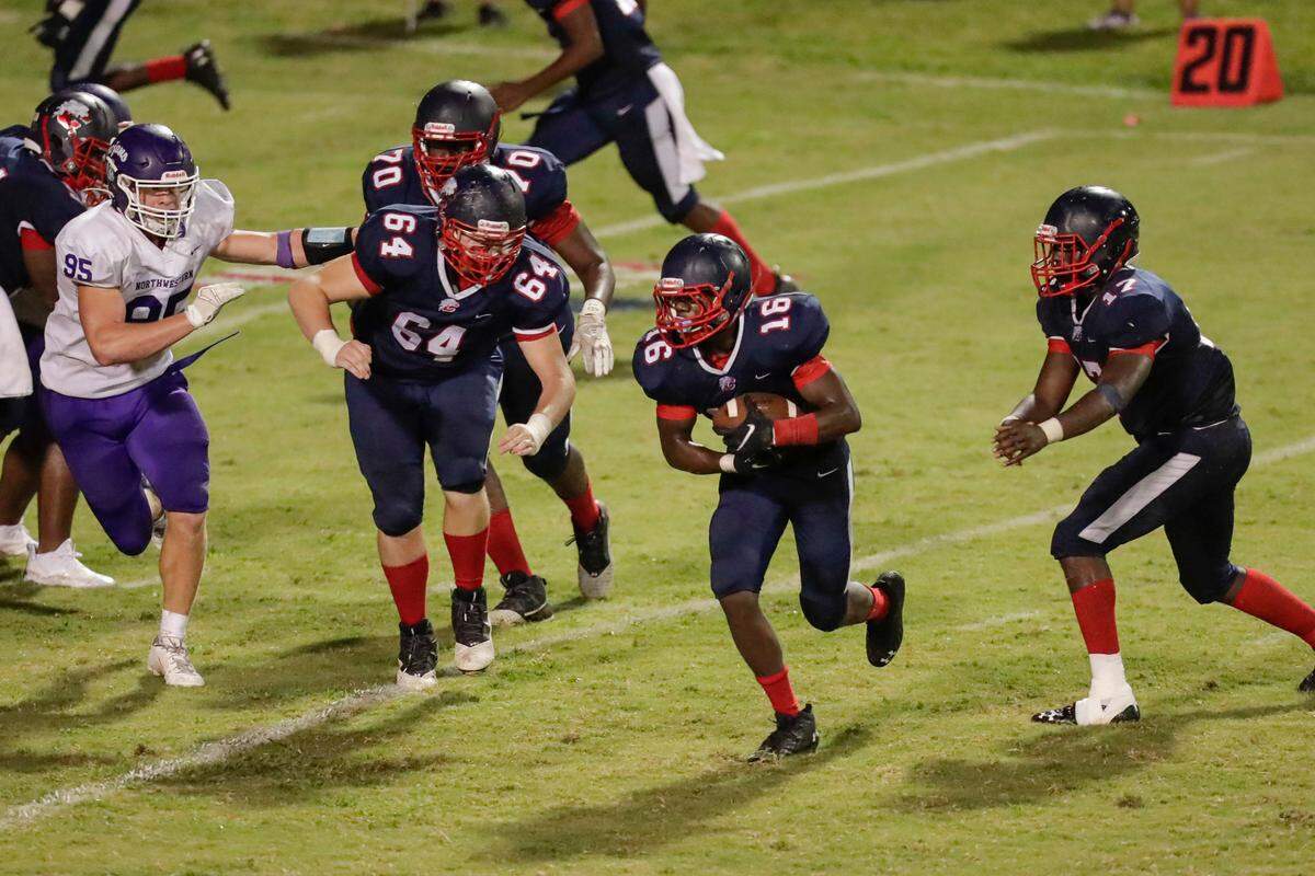 Chester’s (16) Antonio Hopkins carries the ball in second half play as Chester hosts Northwestern in Friday night football 9-10-2021.