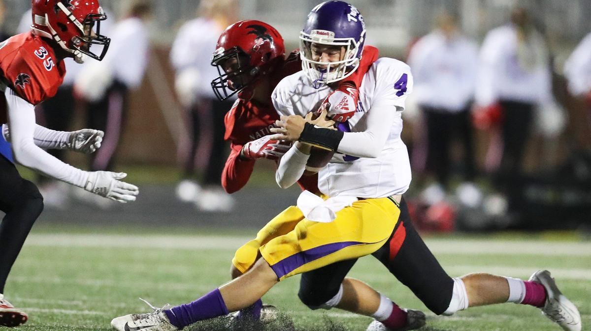 Northwestern quarterback John Duran is taken down short of a first down by Nation Ford’s Callan Sobas.