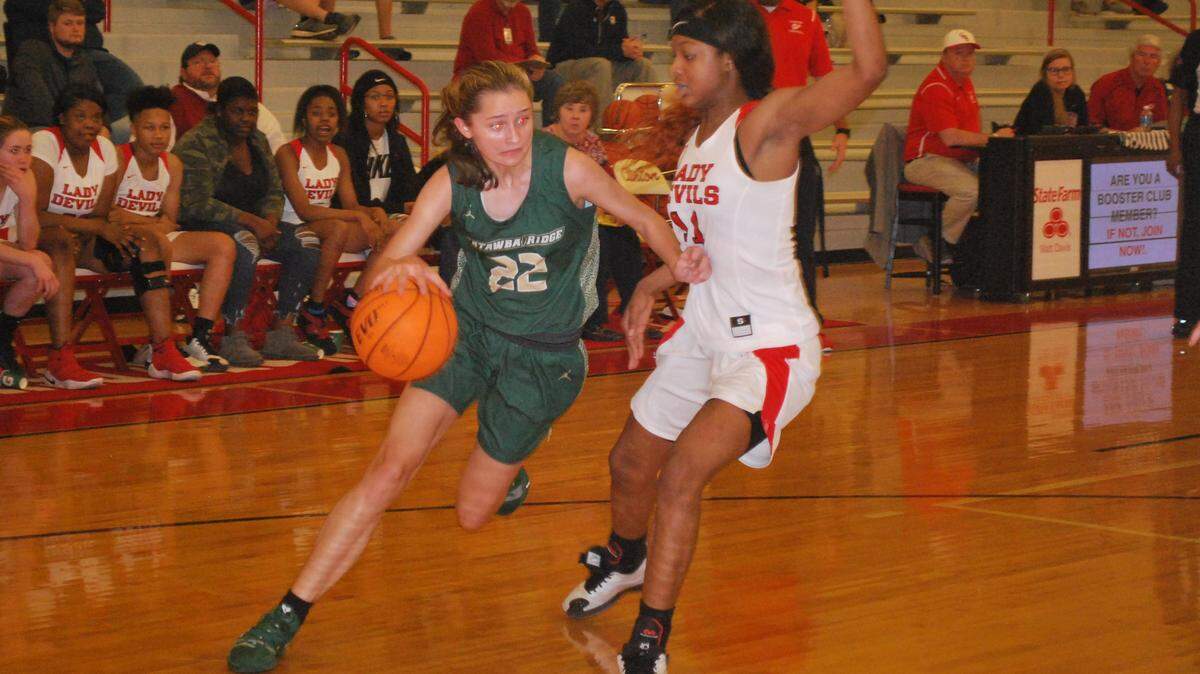 Catawba Ridge’s Tatum Postel, left, was one of three Copperheads to score in their game against Clinton in the first round of the 3A state playoffs.