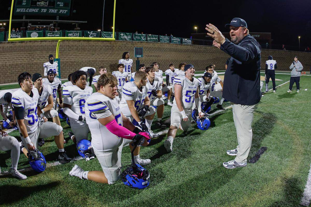 Indian Land football coach Adam Hastings addresses his team as before a game earlier this season at Catawba Ridge in Fort Mill.