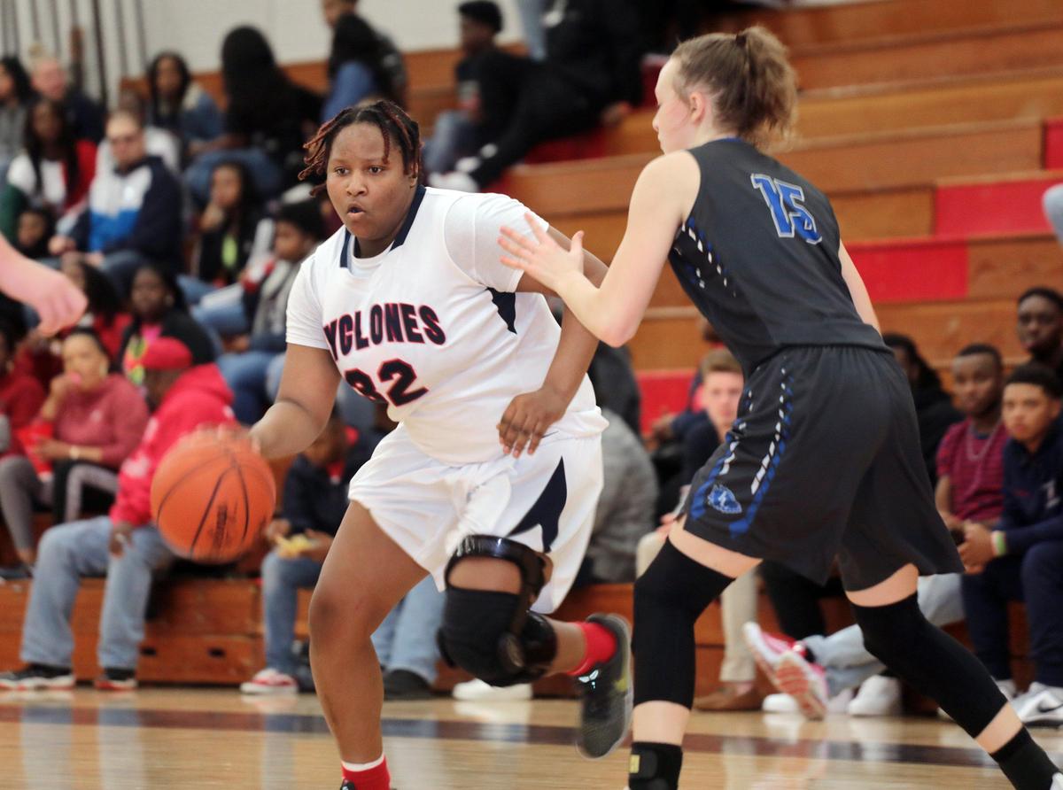 Chester’s Ashanti Kelly heads to the basket around Indian Land’s Allie Floyd Friday at Chester High School.