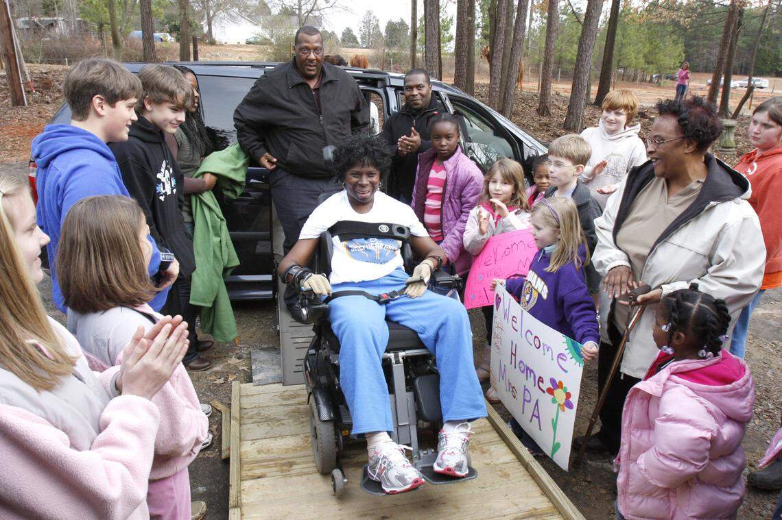 Supporters greet Phyllis Paden-Adams as she arrives home in Rock Hill from Atlanta Saturday.
