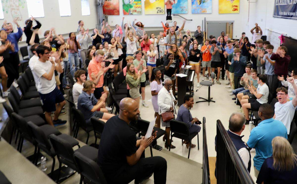EL Dickey is surprised by a room full of his classmates, football teammates and family on Tuesday, May 10, 2022. This was before he knew he’d won the NFLPA scholarship.
