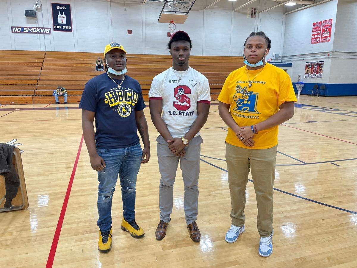 Three Chester High School football players signed National Letters of Intent on Wednesday. From left to right: Quez Jackson, Zan Dunham, Da’Morrious Thompson.