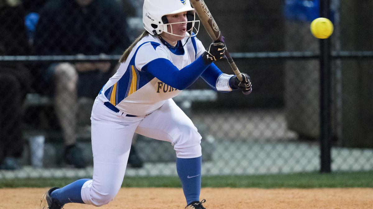 Fort Mill's Keri Nissen lays down a bunt to score a run and put the No. 1 Yellow Jackets on the board as Fort Mill hosts crosstown rival Nation Ford in the varsity softball regular season finale.