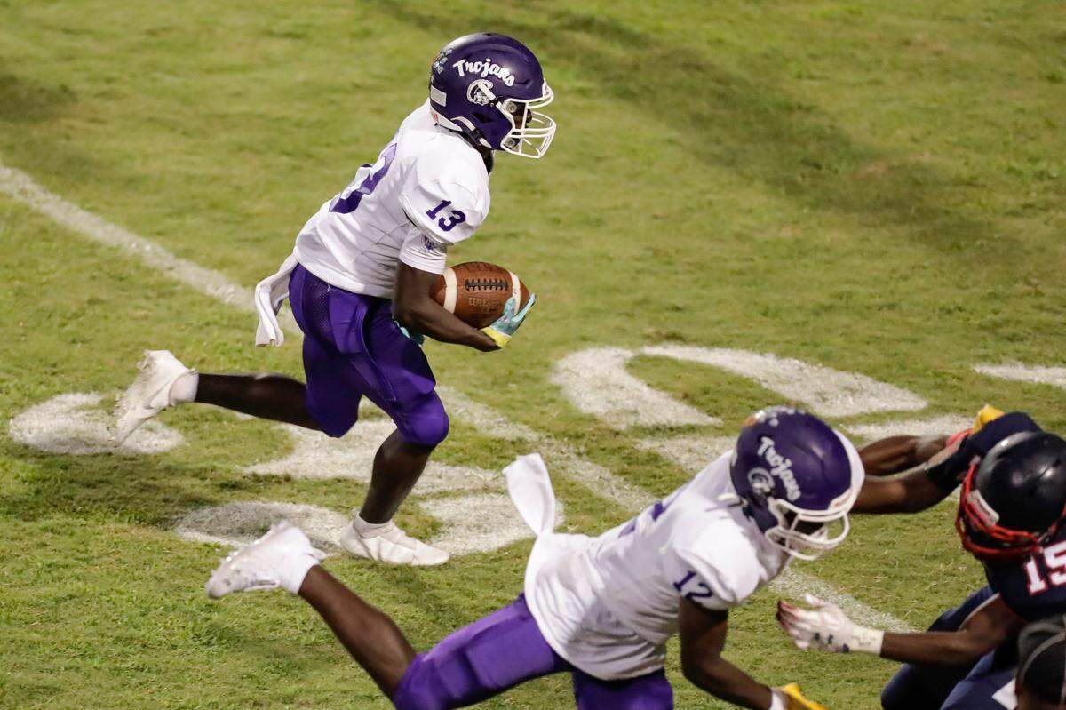 Herald file: Northwestern’s (13) Gerrell Watkins carries the ball in the second against Chester in Friday night football 9-10-2021. The Trojans are on the road again against Greenville this week.