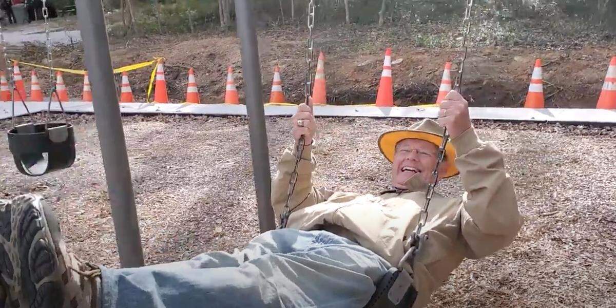 SC Rep. Randy Ligon takes a turn on the swings at the newly improved Wylie Park.