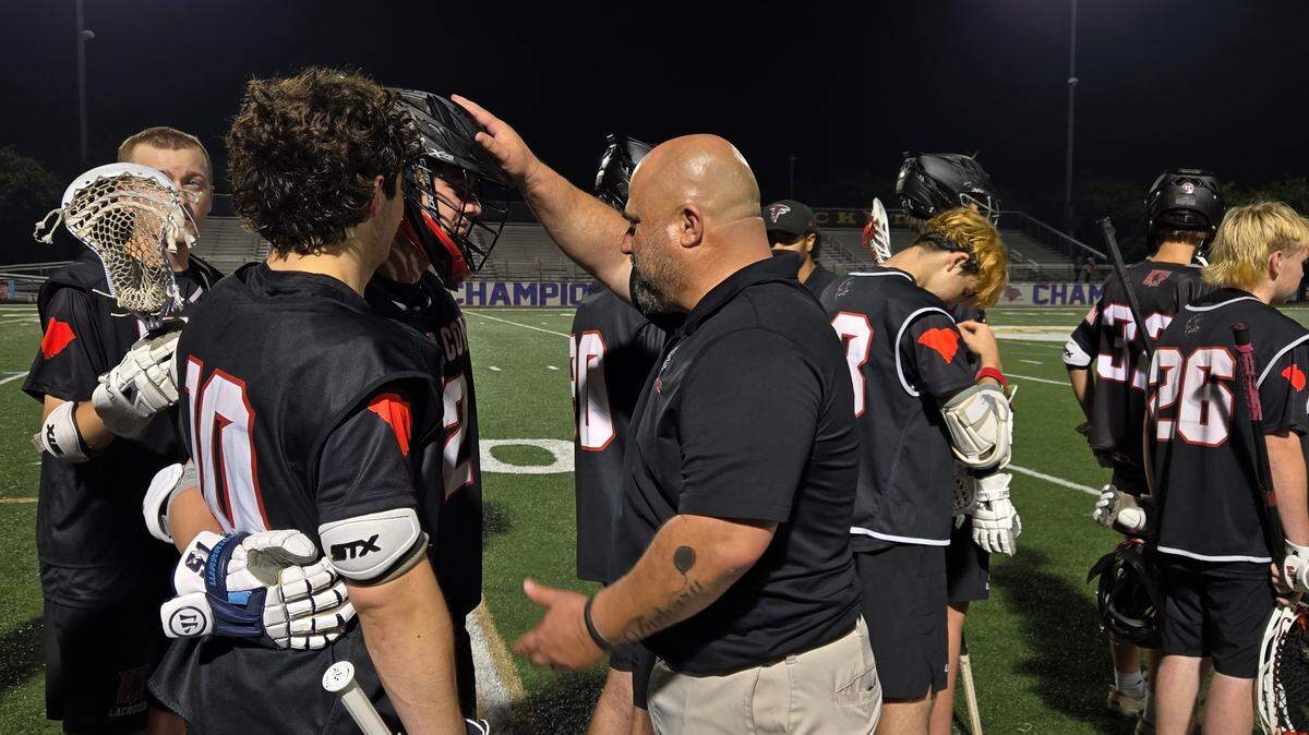 Nation Ford boys lacrosse coach Cory Turner consoles his players after the 14-5 loss to Lucy Beckham in the Class 5A Division II championship on Saturday, May 3, 2025.