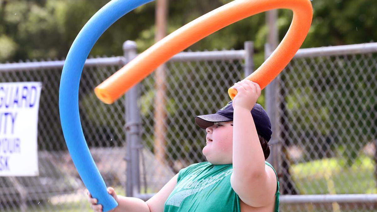 It’s time for parents to sign their children up for summer camp programs. In this Herald file photo, Taylor Bellamy plays with water noodles at the Boyd Hill community pool in Rock Hill.