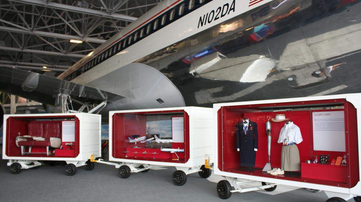 At Atlanta museum, airline seats and uniforms displayed in repurposed baggage carts in Hangar 2, which houses Delta’s first Boeing 767-200, known as “The Spirit of Delta.”