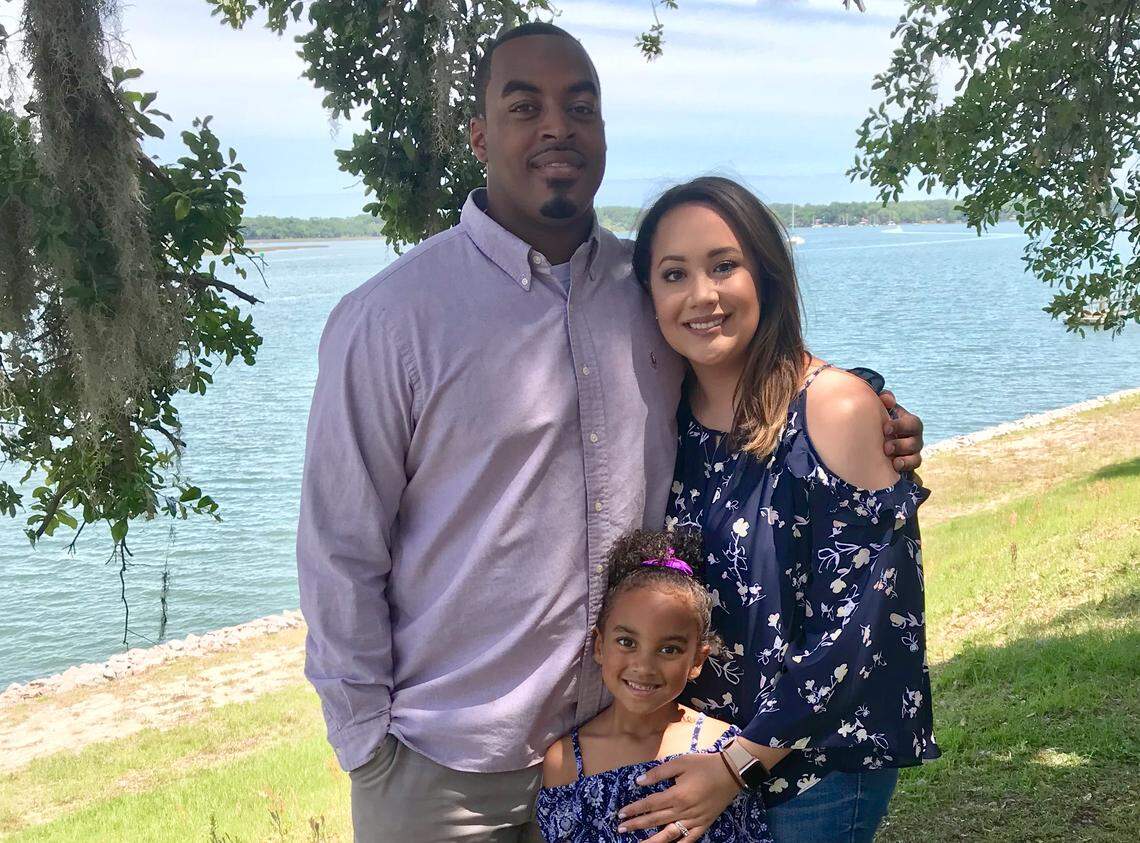 DeVonte Holloman with his wife, Angelina, and daughter, Brooklyn.