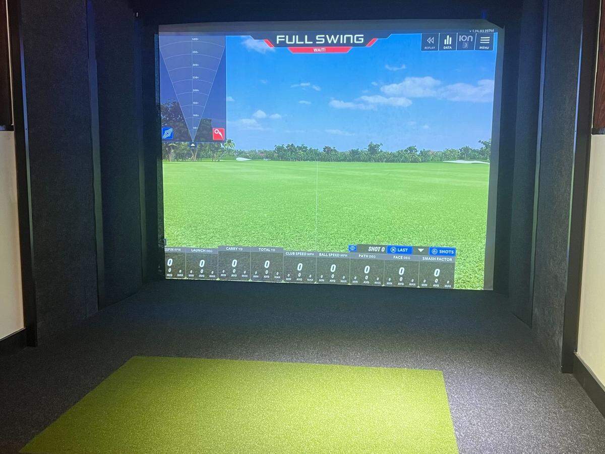 A golf simulator at 19th at the Warehouses.