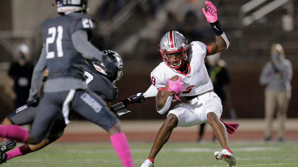 South Pointe’s #9 Omega Blake looks to break free in first half play as the York Cougars host the South Point Stallions in conference play Friday night, 10-23-2020.