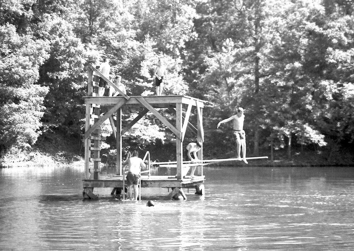 Boy Scouts Daniel Jessee and Ben Deason, both 12, jumped into the refreshing waters of Nims Lake during scout camp in this Herald file photo. Property near Nims Lake could now have more than 100 homes built on it.