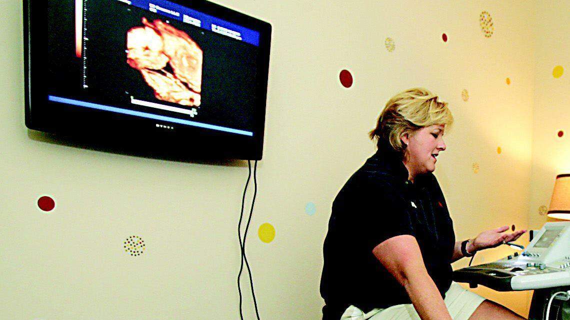 Pamela Manley performs a 3D/4D prenatal ultrasound on Suzanne Pressley at 3D Dreams in Baxter Village.