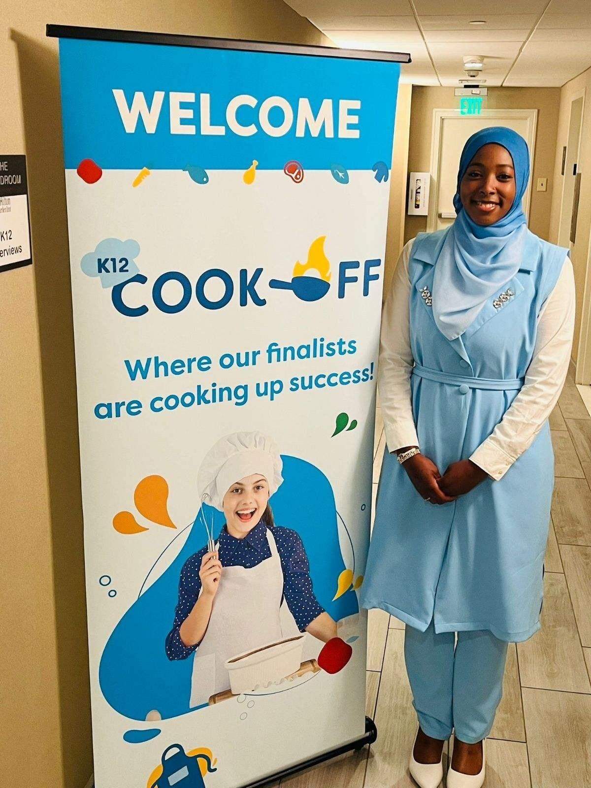 Aliyah Abdallah with a welcome sign for the arriving finalists in Arlington, Virginia at the K12 Cook Off. York resident Abdallah, 17 entered the K12 Cook Off and was among six finalists who competed in Arlington, Virginia