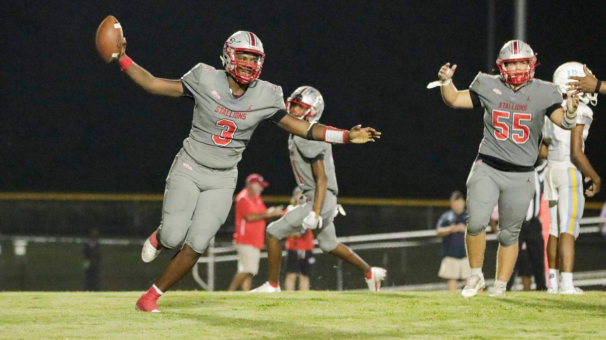 South Pointe quarterback (3) Zay McCrorey scores in second overtime as the South Pointe Stallions host the South Florence Bruins in Friday night football action, 9-17-2021.