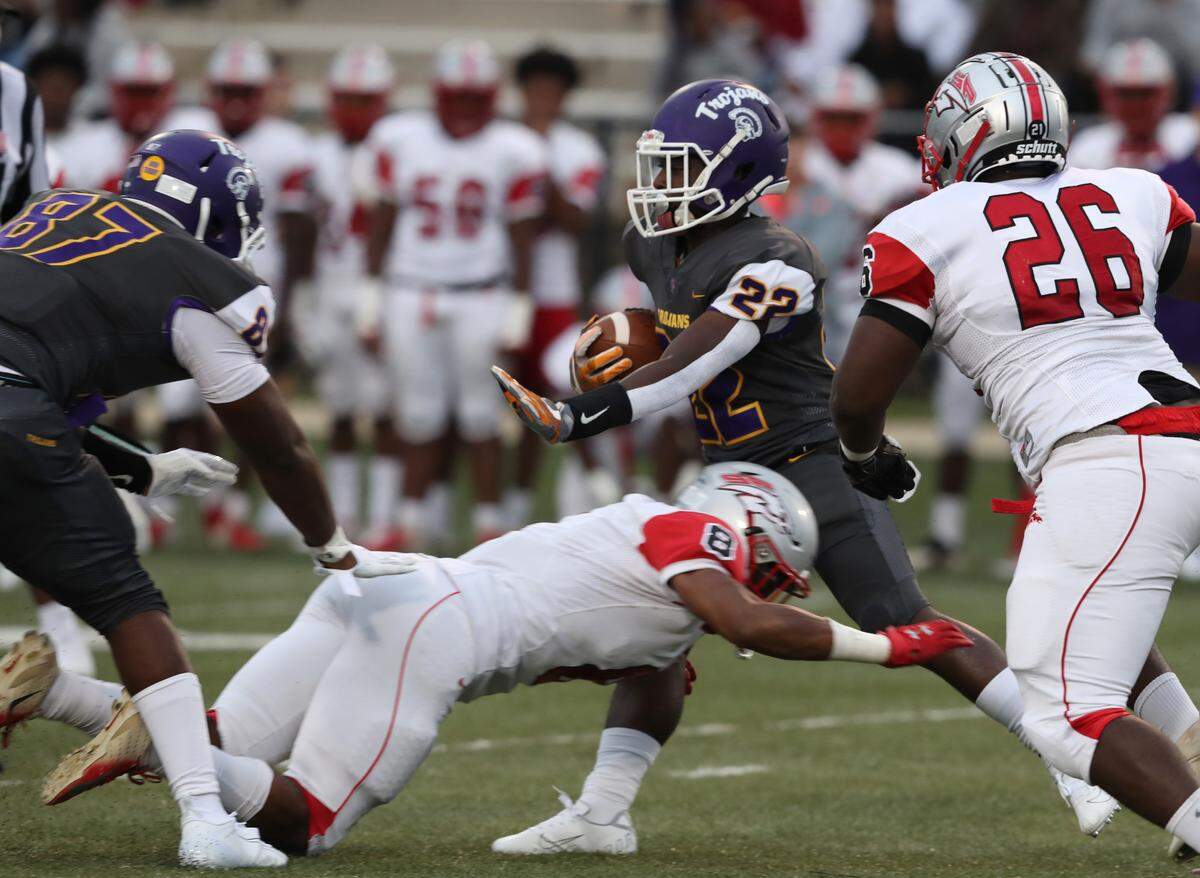 Northwestern’s Zay Page is taken down by South Pointe’s Kobe Shannon.