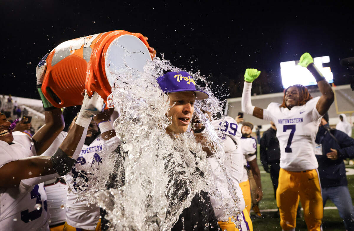 Northwestern head coach Page Wofford is doused with water following his team’s win over Irmo in the Class 5A-D2 football state championship game at Oliver Dawson Stadium in Orangeburg on Saturday, December 14, 2024.