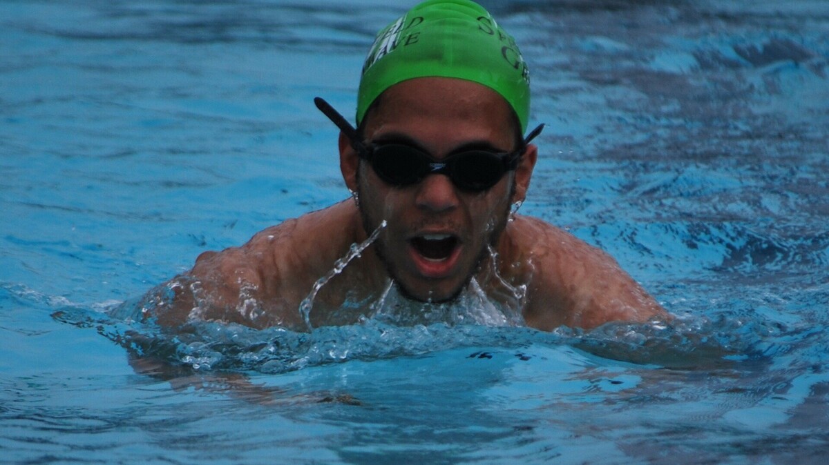 Springfield’s Carter Richardson swims the breaststroke during a recent morning practice with the Greenwave.