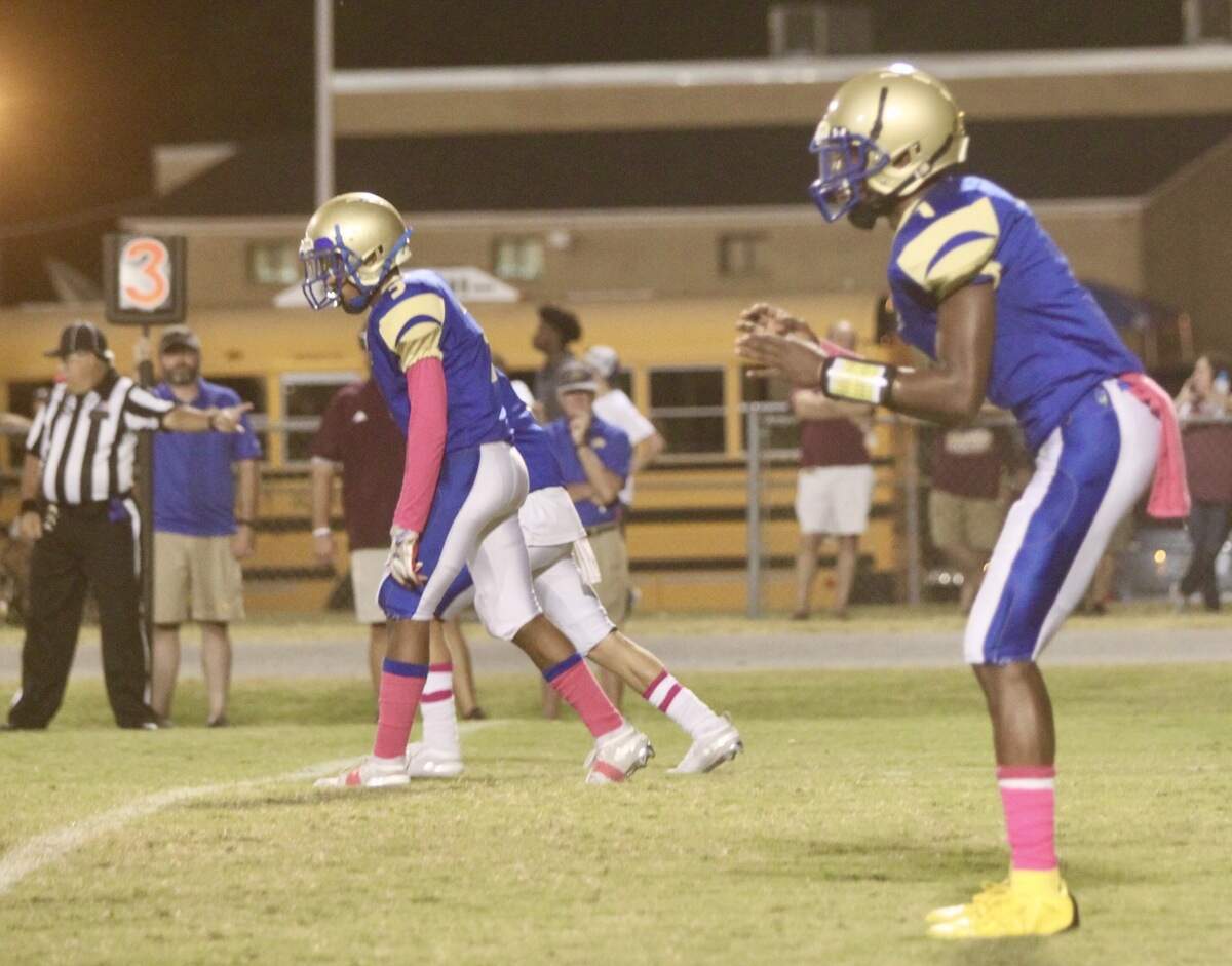 Demetric Hardin takes a snap at quarterback in his senior season at Lewisville. Hardin threw for over 1,400 yards and 11 touchdowns in his high school football career.