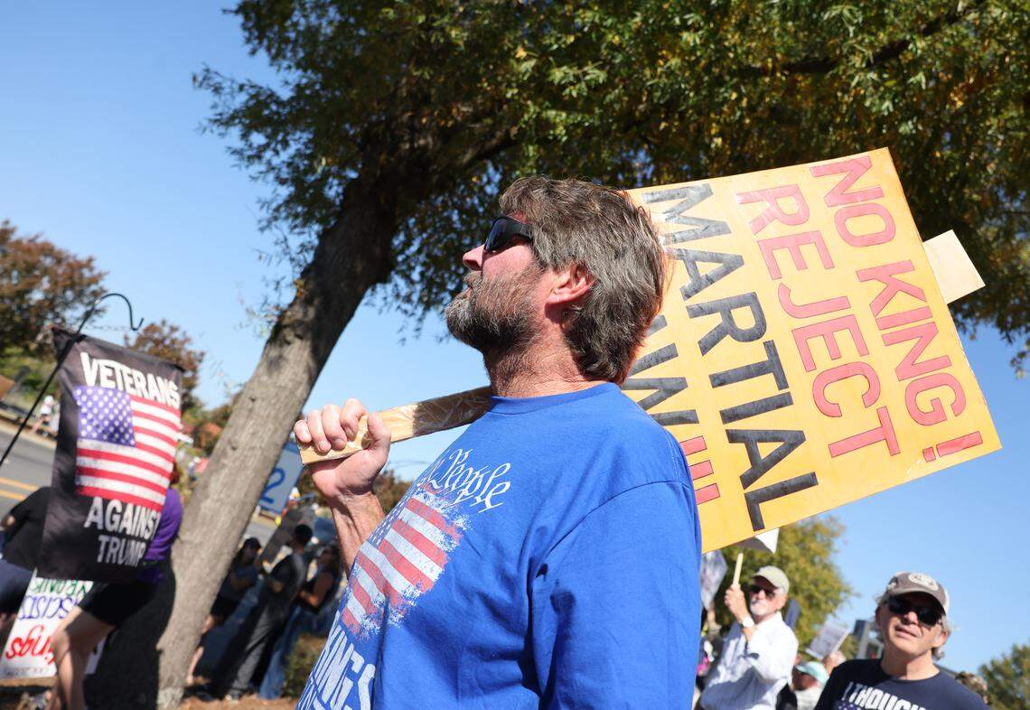 Jay McKinney holds an anti-Trump sign Saturday at the ‘No Kings’ rally in downtown Rock Hill.