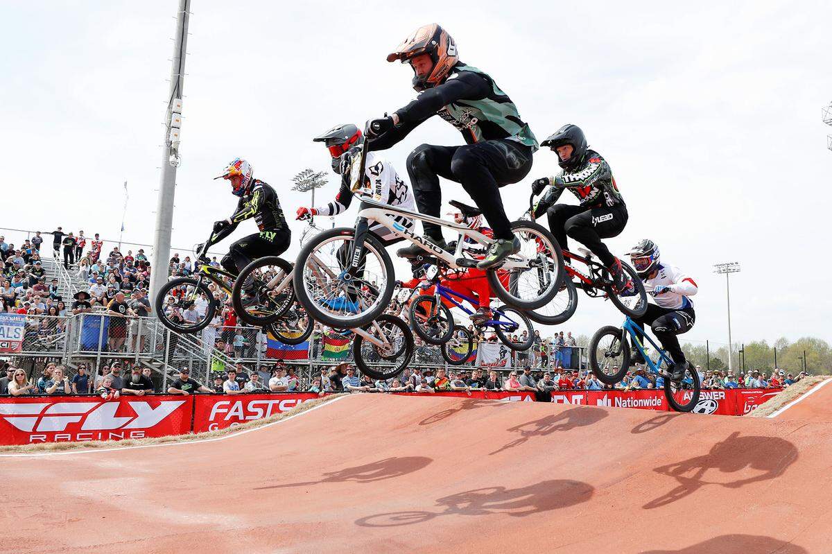 Riders make their way down the the first straightaway during the USA BMX Carolina Nationals and USA Cycling Elite National Championships at the Rock Hill BMX Supercross Track in March 2019.
