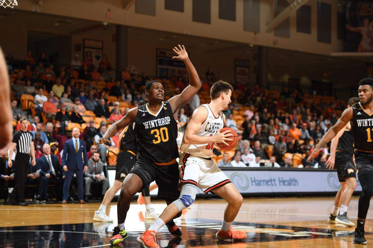 Winthrop’s DJ Burns defends in the post in the Eagles’ conference matchup with Campbell on Saturday, Jan. 4, 2020.
