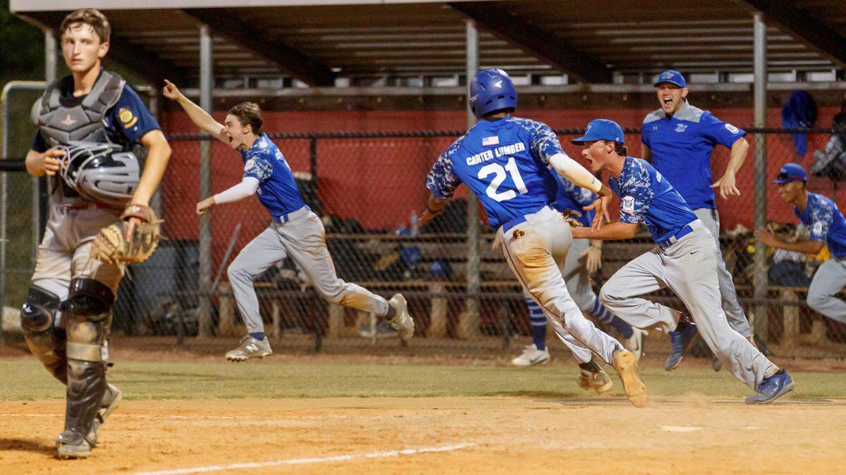 Fort Mill celebrates the win as #21 Cameron Greene crosses home plate for the win after a walk off double by Carson Jones as Fort Mill Post 43 defeats Rock Hill Post 34 in June 2019. American Legion baseball has returned in the summer of 2021.