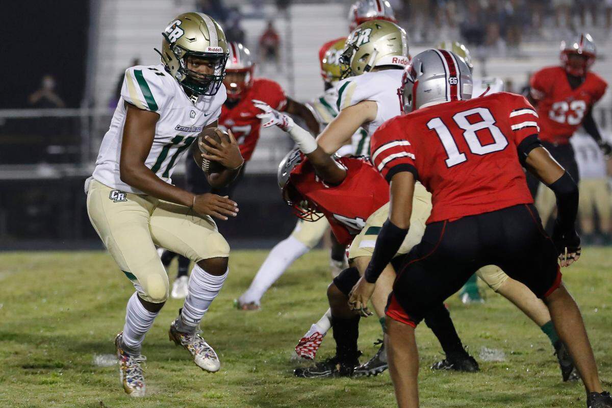 Catawba Ridge’s #11 Quinten Jackson carries the ball in early play as South Pointe hosts Catawba Ridge in Friday night varsity football.