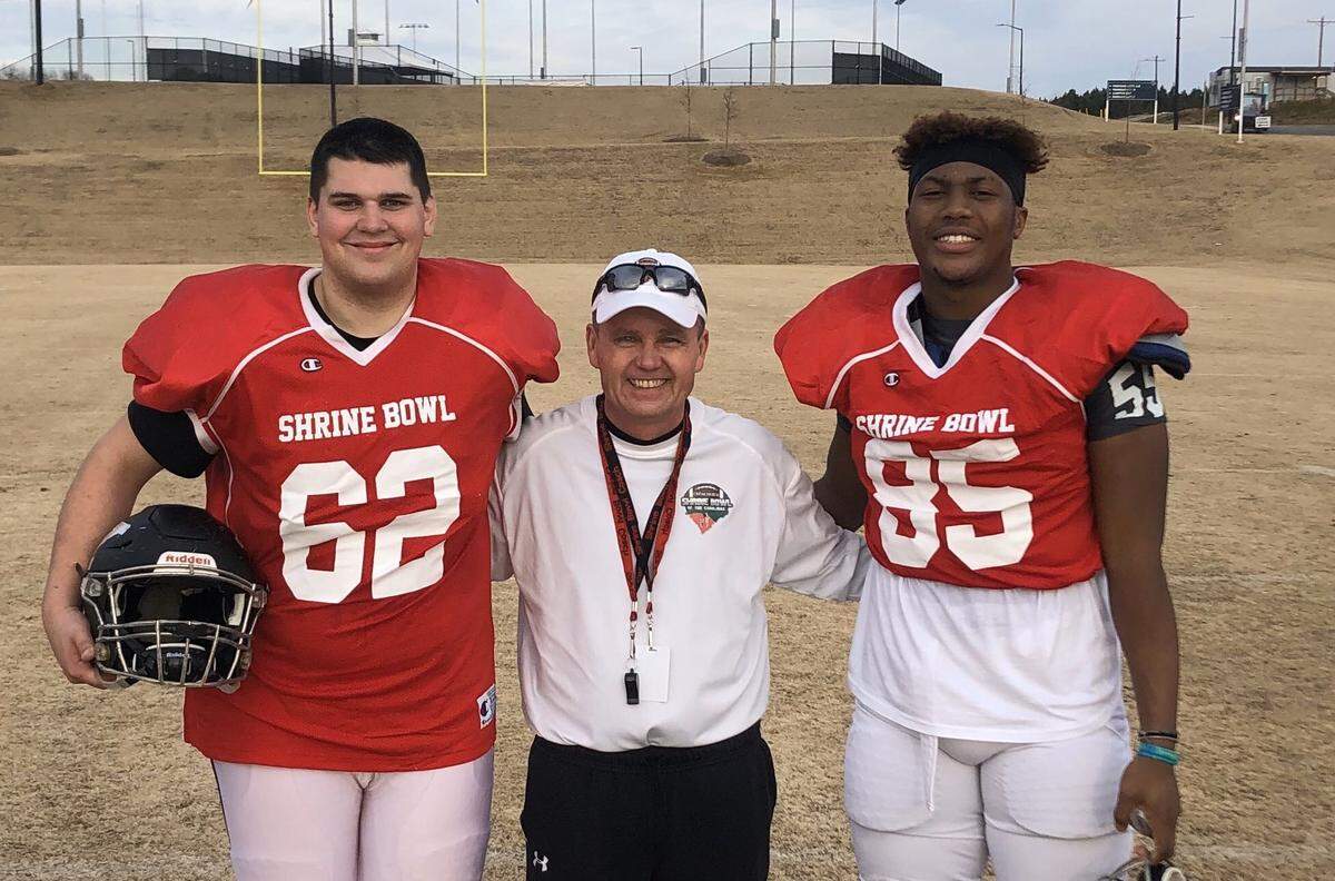 From left to right: Will Boggs, York head coach Dean Boyd and Khalil Ellis pose for a picture at a 2019 Shrine Bowl practice. Boggs signed as a preferred walk-on to Clemson in February.