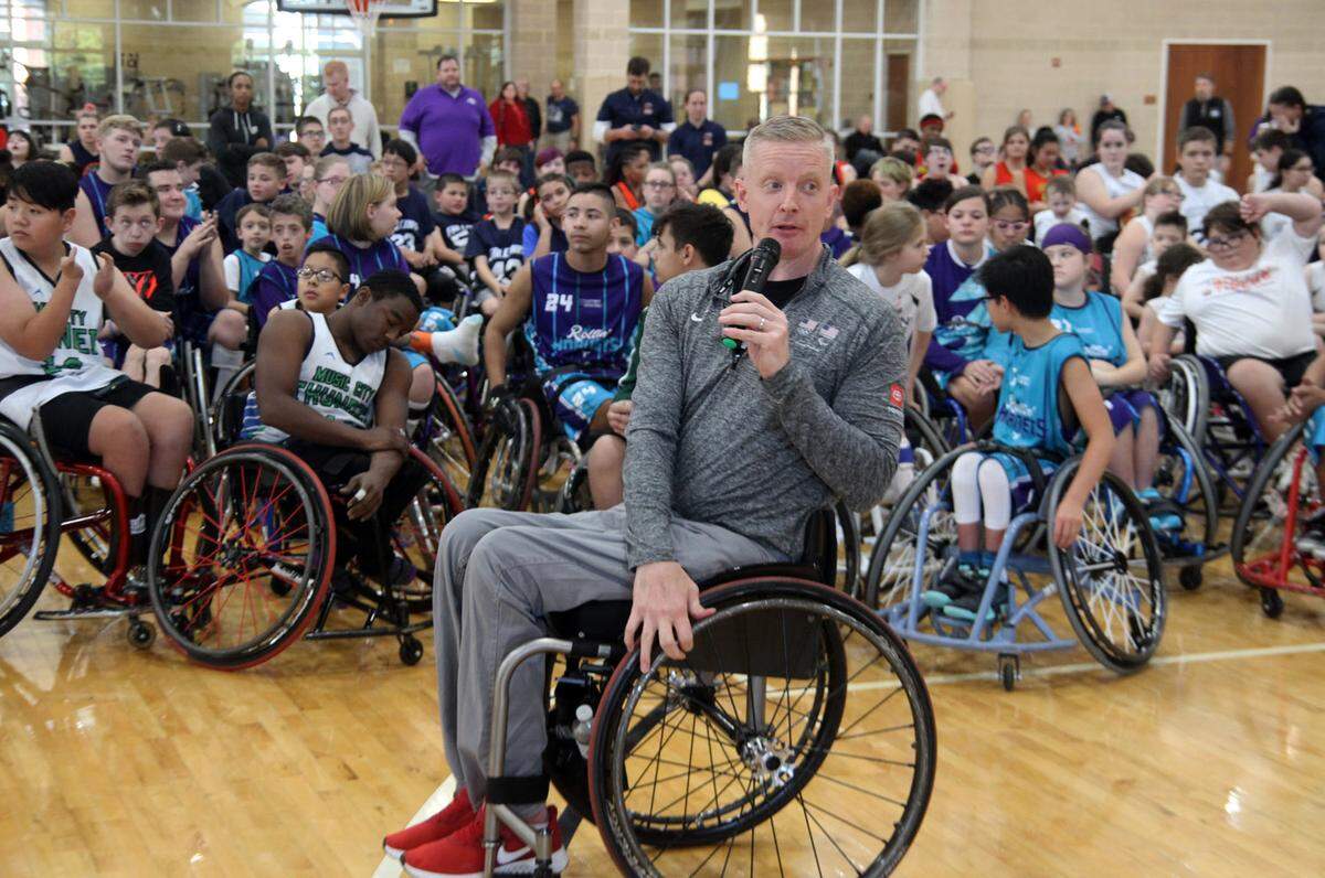 Will Waller speaks to the adaptive athletes during the 2019 Queen City Classic. Waller, a former U.S. Paralympian, is the CEO of the National Wheelchair Basketball Association.