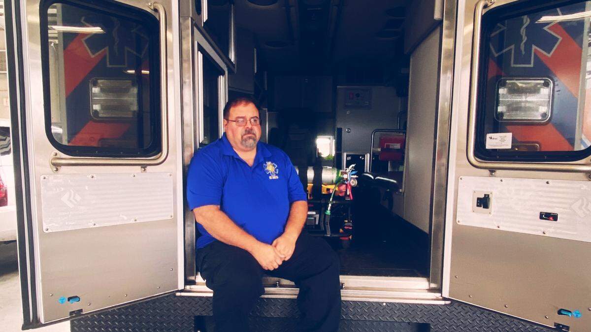 Britt Lineburger, Chief of Chester County EMS, sits outside one of the county’s ambulances.