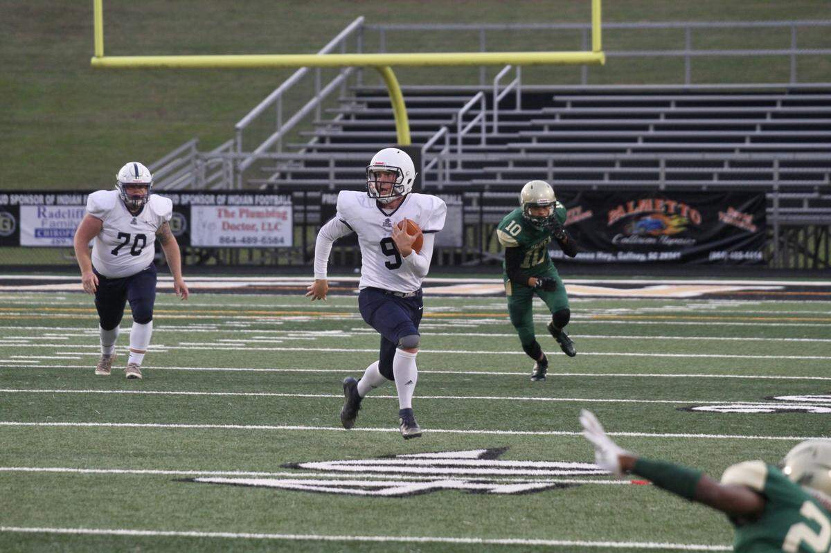 Legion quarterback Joey Hylinski runs for a first down against Berea in a 2020 preseason scrimmage in Gaffney.