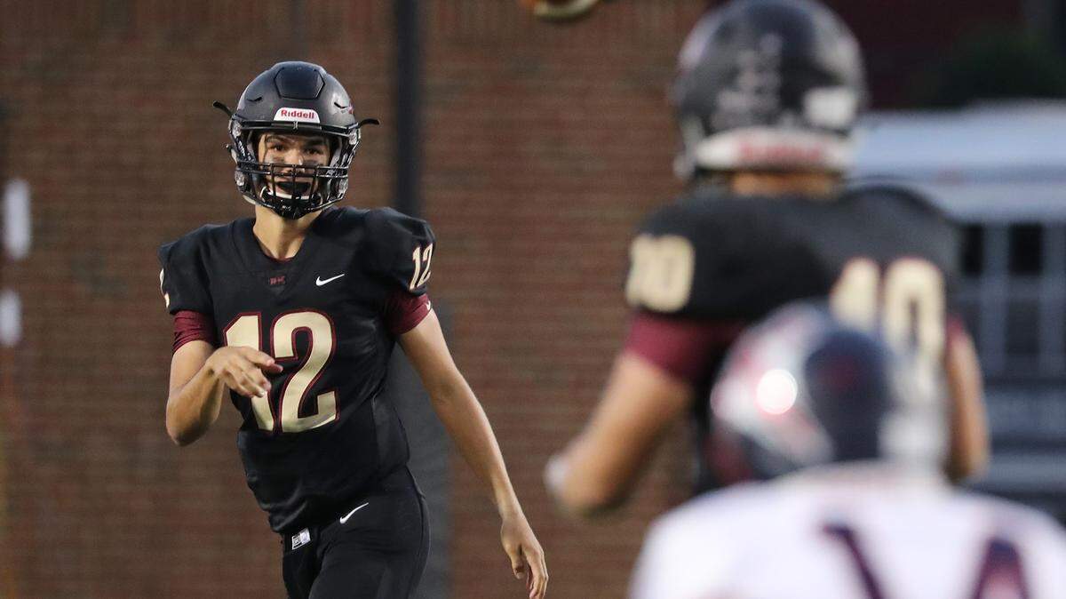 Rock Hill hosted Lugoff-Elgin. Rock Hill quaterback Hayden Jackson completes a pass .
