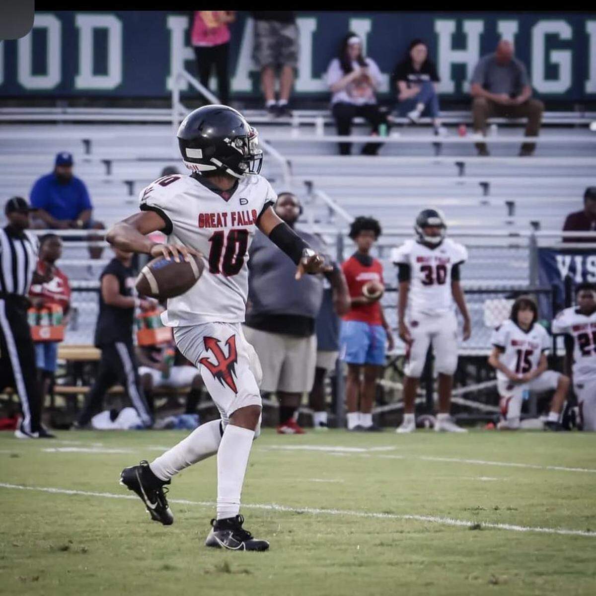 Great Falls QB Tremaine Caldwell attempts a pass in the Red Devils’ 2023 season opener against Heathwood Hall.
