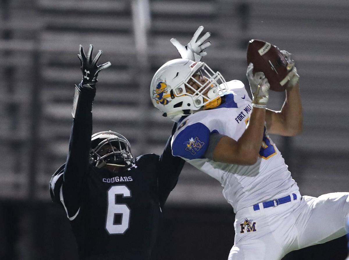 Fort Mill’s Avery Wilcox intercepts a York pass in the first quarter.