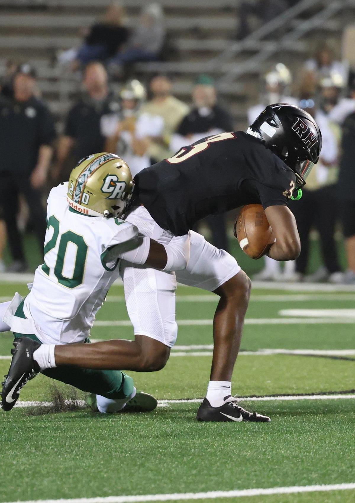 Rock Hill’s Malik Clark is pulled down by Catawba Ridge’s Josh Dobson