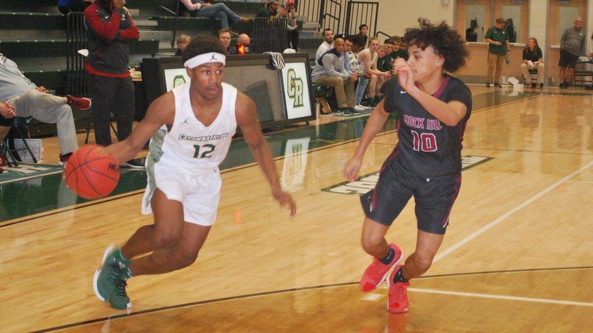 Catawba Ridge’s Jacobie Henderson drives to the basket around a Rock Hill defender during his team’s recent win on Wednesday, Jan. 29, 2020.