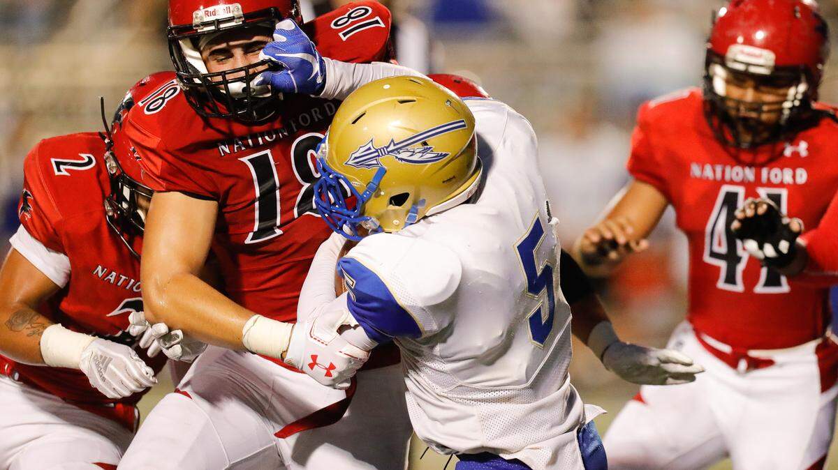 Nation Ford’s #18 Nathan Lovette try’s to take down Indian Lands #5 Brandon Britton as Nation Ford hosts Indian Land in varsity football Wednesday 9-12-2018.