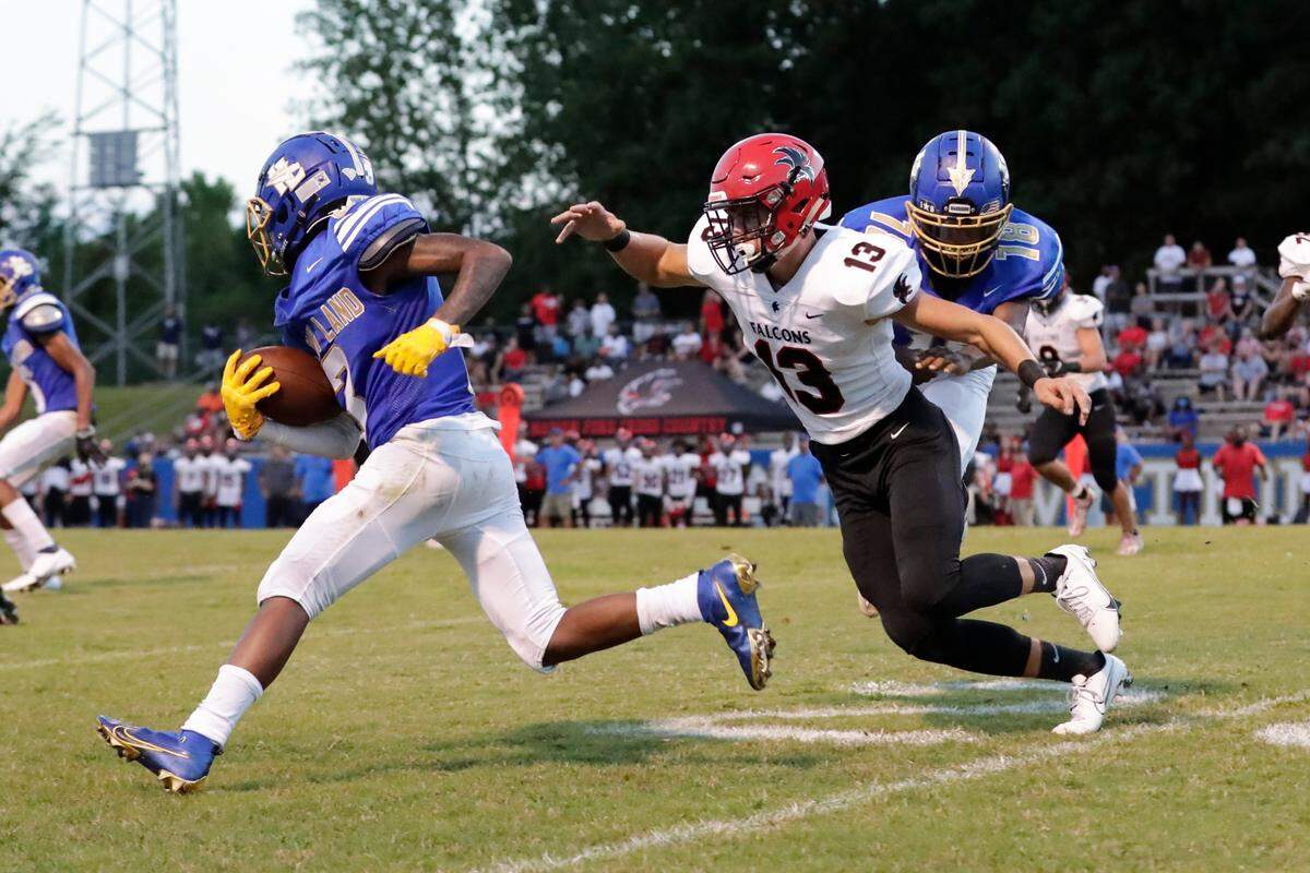 Indian Land’s (3) Sean McCray gets past Nation Ford’s (13) Daniel Childs as Indian Land hosts Nation Ford in Friday night football action. 8-20-2021.