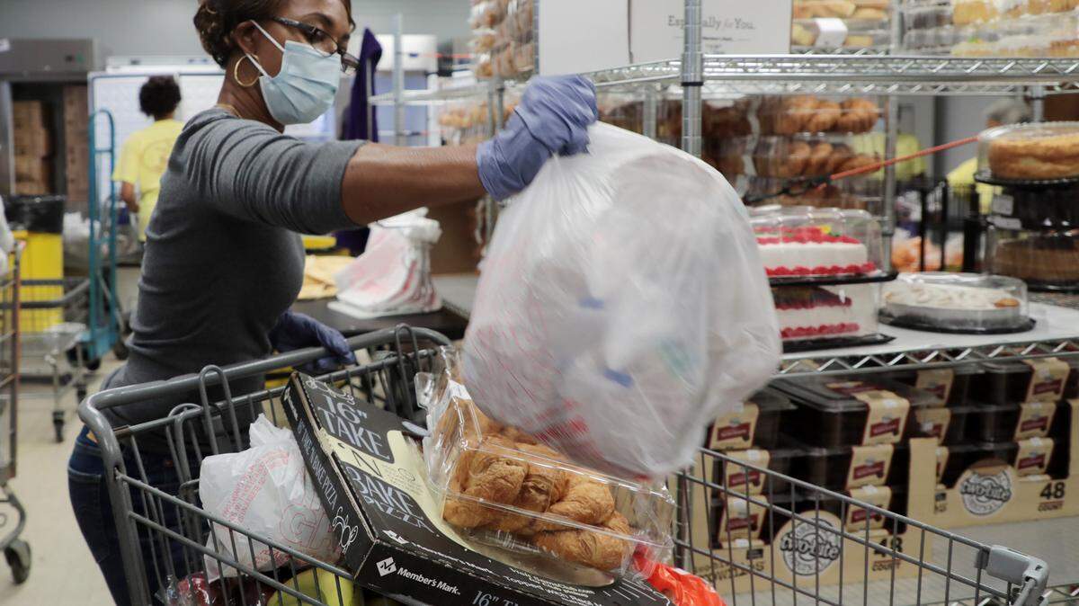 Dee Parker sorts through groceries at the Manna House Pantry, located at Rock Hill’s Pathways Community Center..