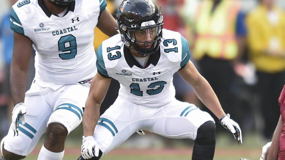 Coastal Carolina’s Chandler Kryst shifts direction in a game in September 2018. Kryst, through three games in 2019, is tied for having the most interceptions in the NCAA.