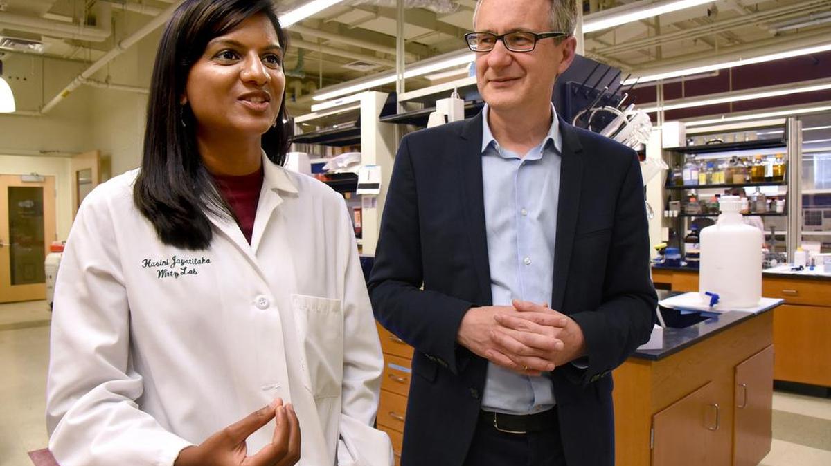 Hasini Jayatilaka, left, a post-doctoral fellow and Denis Wirtz, professor of chemical and biomedical engineering, who work together at the Institute of NanoBioTechnology at Johns Hopkins University, discuss their discovery that a biochemical signaling process that causes the spread of cancer cells can be slowed down with the use of two existing drugs.
